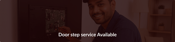 TVcaree technician repairing a television at a customer’s home, showing doorstep TV repair service.