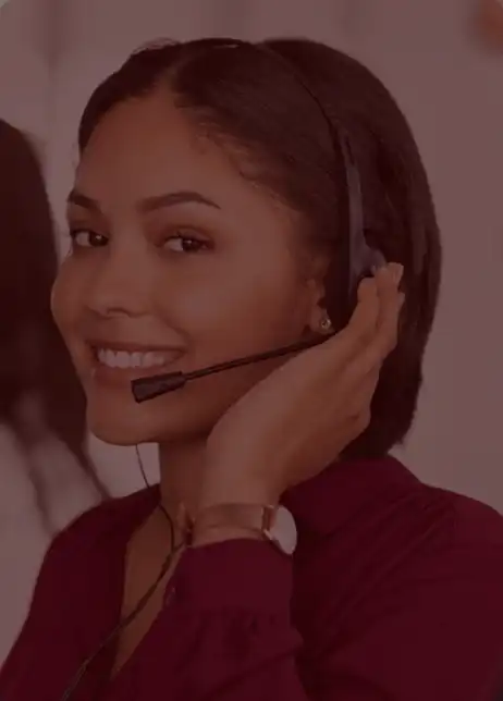 Customer support representative with a headset providing assistance for TVcaree’s TV repair services.